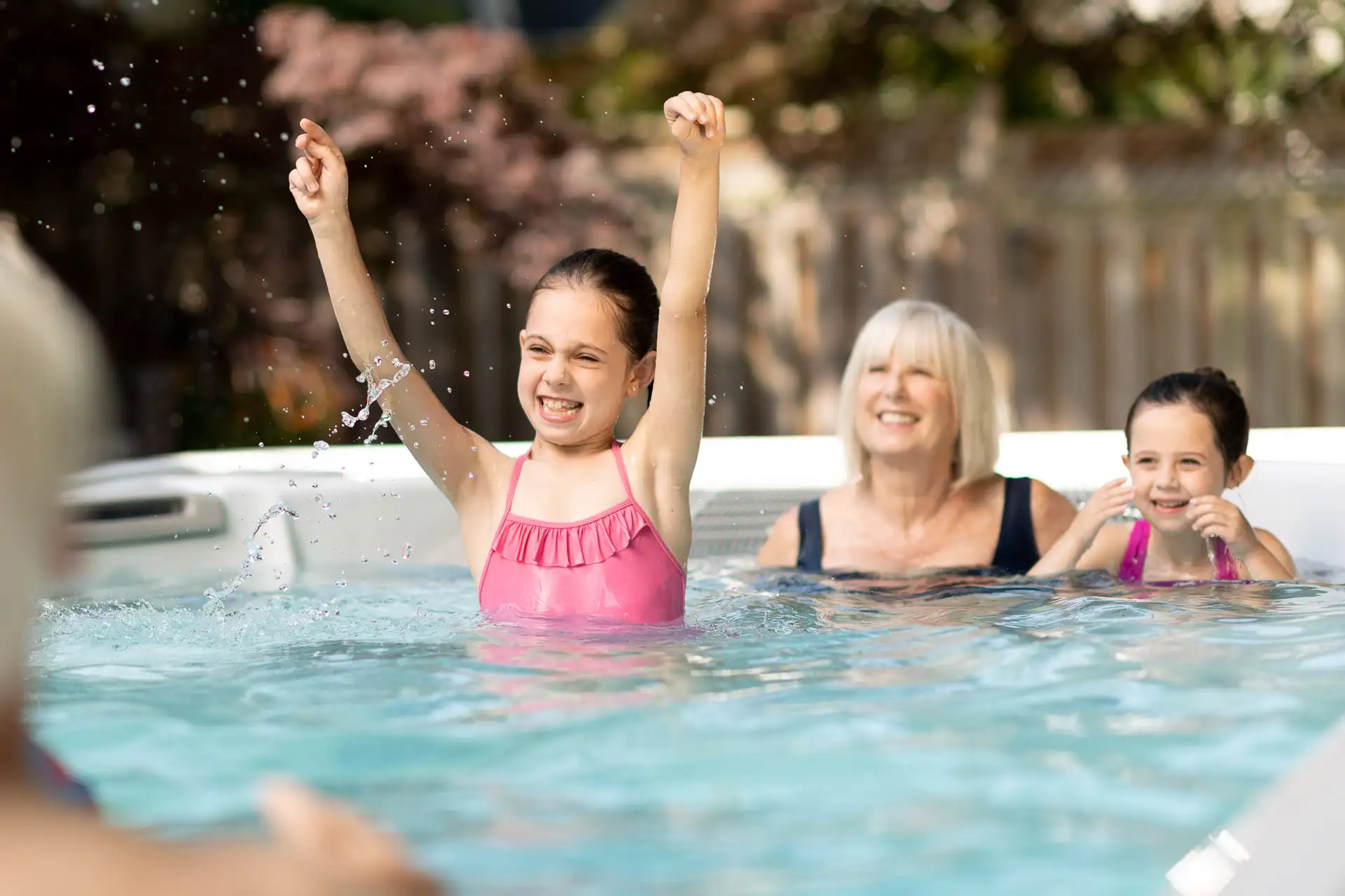 Family Playing In Swim Spa